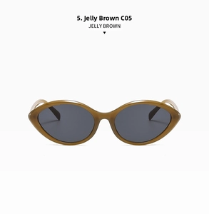 Detail of vintage cat-eye sunglasses in jelly brown frame with dark grey lenses