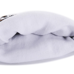 Close-up of soft white fleece lining and thick knitted texture for winter warmth