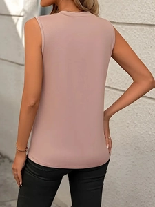 Detail view of the back of a dusty pink sleeveless tank top showing the premium knit fabric