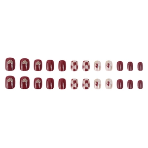 Short square press-on nails in burgundy with glitter hearts and checkered patterns