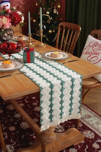 Close-up of geometric diamond pattern and tassel detail on cotton Christmas table runner
