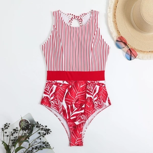 Detail of red and white striped one-piece swimsuit with tropical leaf print and tie-up neckline