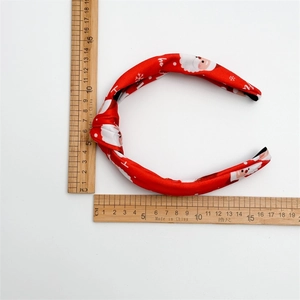 Red Christmas knotted headband with Santa Claus and snowflake prints for women