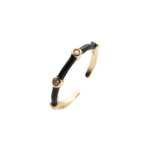 Detail of adjustable gold ring with black enamel inlay and two small zircon stones