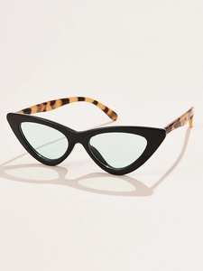 Top-down view of retro cat-eye sunglasses with green lenses and tortoiseshell temples
