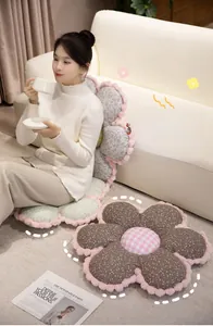 Detailed view of floral plush seat cushion featuring soft fabric and petal shape design