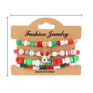 Detailed view of Christmas beaded bracelet set with reindeer and gift box charms on card