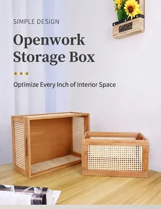 Close-up of two wooden storage boxes with woven grid sides on a minimalist desk