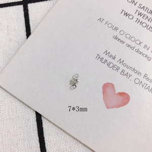 Detail of a 7x3mm silver pendant connector with white zircon for DIY jewelry