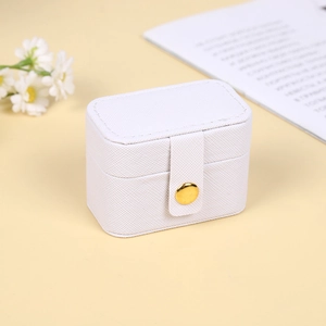 White textured mini jewelry box for rings and earrings with gold button closure