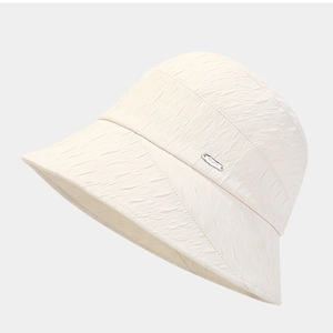 Minimalist white pleated sun hat with metal logo plate, stylish summer bucket hat for women