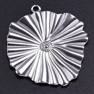 Macro shot of 304 stainless steel irregular flower pendant with radial textures