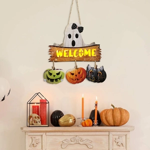 Detail of Halloween welcome sign featuring a ghost, LED pumpkin decor, and a rustic rope