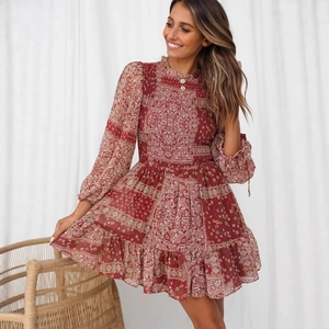 Bohemian paisley floral long sleeve mini dress with ruffled hem and smocked waist detail