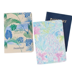 Detail view of durable PU leather passport covers featuring tropical and floral prints