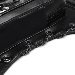 Macro detail of gothic punk bag with metal zipper, chain, and eyelet on black leather