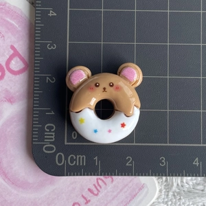 Detailed size measurement of a cute bear donut resin charm on a scale mat