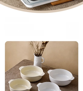 Close-up of ceramic soup bowl with handles and textured horizontal ribbing