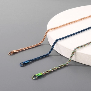 Detailed shot of twist chain necklaces in rose gold, blue, and rainbow titanium steel