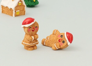 Macro view of miniature gingerbread men with red Santa hats and frosting details