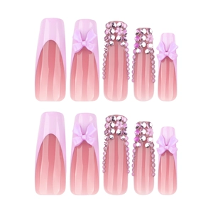 Long coffin french fake nails in pink and purple with 3D bows and shiny rhinestones