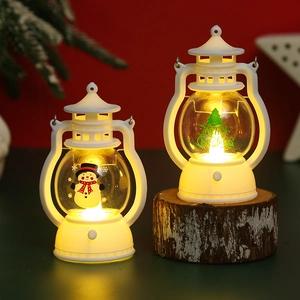 Close-up of white LED Christmas lanterns with snowman and Merry Christmas tree motifs