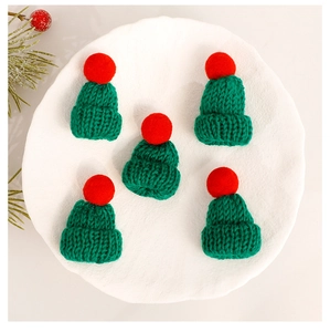 Set of five mini red and green knitted Christmas hats for DIY festive decorations