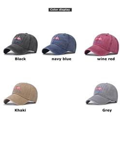 Detailed color display of washed vintage baseball caps with flamingo embroidery
