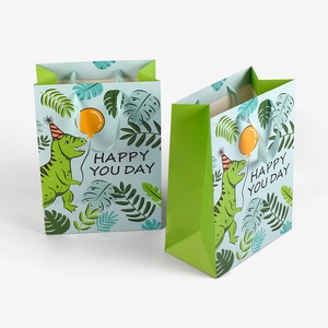 Large blue dinosaur gift bag with green handles and Happy You Day cartoon print