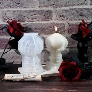 Detail of gothic hand holding ball candle mold and the finished resin casting craft