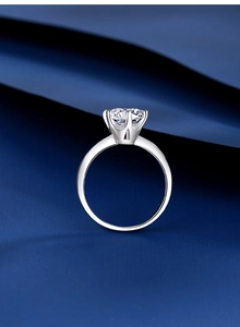 Macro shot of 2 carat moissanite ring showing the classic six-prong setting detail