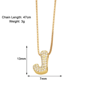 Detailed view of gold letter J pendant with zircon inlay showing size and weight specs