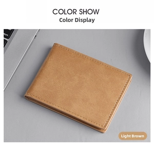 Detailed view of a light brown slim bifold wallet on a professional office desk setting