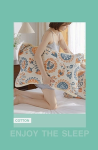 Detail of four-layer cotton pillow towel with bohemian pattern and elastic strap