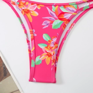 Detail of rose red tropical floral bikini bottoms with reinforced stitching and soft lining