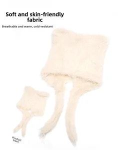 Detail view of cream plush bear ear hat showing front and back fluffy faux fur texture
