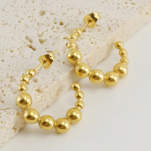 Golden 18K stainless steel C-shaped hoop earrings with beaded gradient on stone base