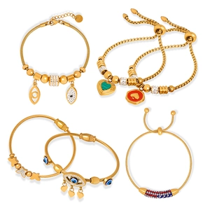Gold-plated evil eye, heart, and butterfly charm bracelets and bangles set