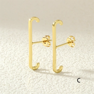 Minimalist gold ear cuff with single row diamonds and unique curved line design