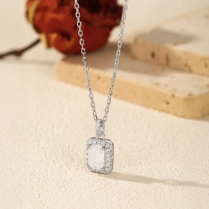 925 sterling silver necklace with emerald cut moissanite pendant and halo detail