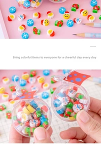 Close-up of mini Christmas themed erasers inside a transparent crystal ball gift set