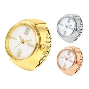 Close-up of three elegant ring watches in gold, silver and rose gold with Roman numerals