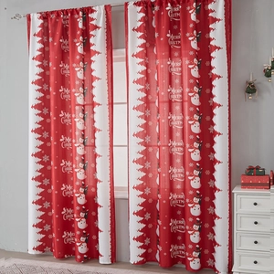 Detail of Christmas snowman curtains with festive red prints and Merry Christmas text