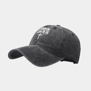 Close-up of vintage washed cotton baseball cap with religious print and cross detail