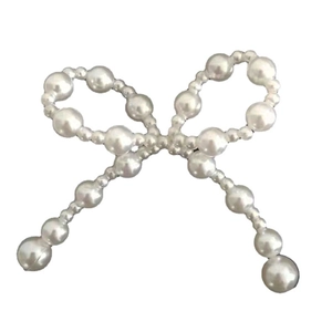 Elegant pearl bow accessory made of multiple white beads for hair and DIY crafts