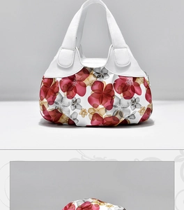 Detail showing red and pink floral patterns on high-quality white PU leather handbag
