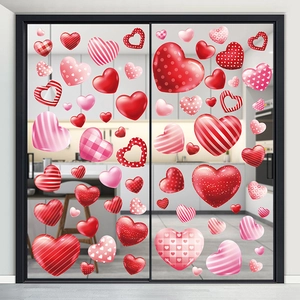 Macro shot of 3D heart glass stickers with stripes and dots on a kitchen glass door