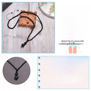 Detail showing the adjustable cord design and high-quality black onyx beaded necklace cord