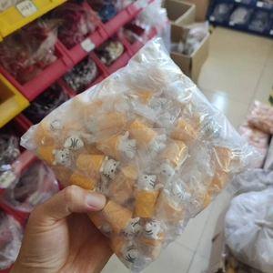 Bulk package of white cat ice cream figurines in transparent plastic bags for storage