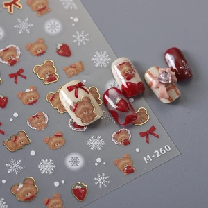 3D gold bear nail stickers with red bows and strawberry designs for festive winter manicures